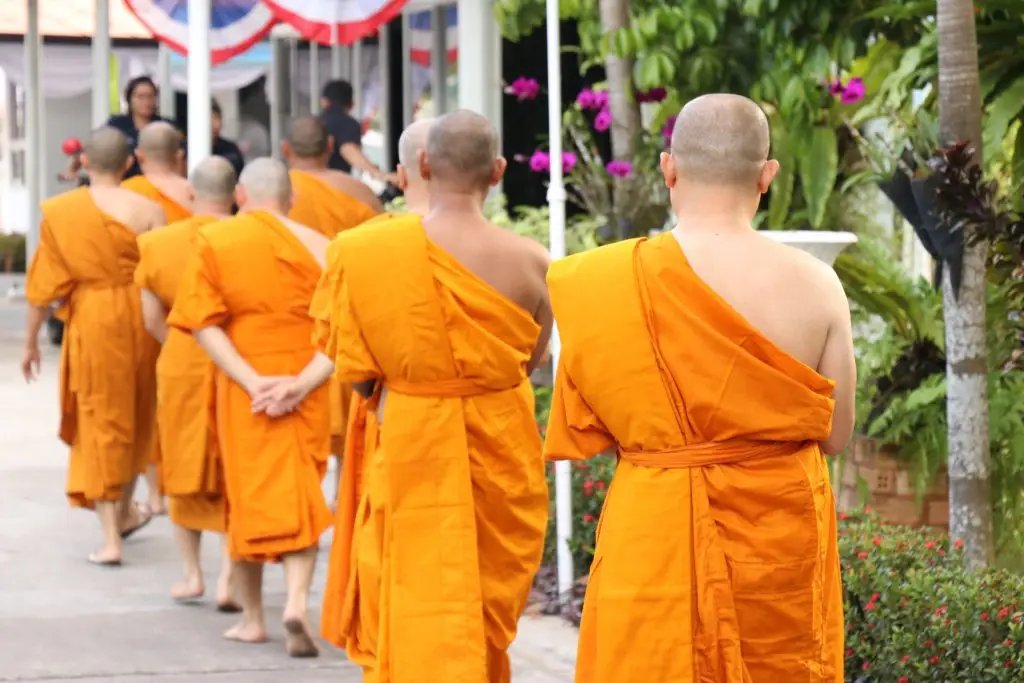 The Buddhist monk shaves his head, leaves his family, and puts on a robe to look like someone differen